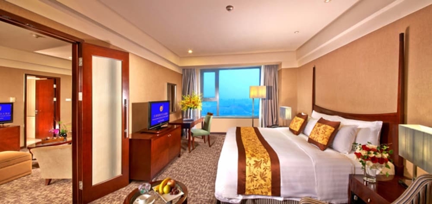 Imagen de la habitación del Hotel Grand New Century Binhai Tianjin. Foto 9