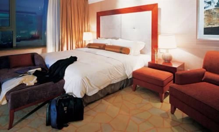 Imagen de la habitación del Hotel Grand New Century Binhai Tianjin. Foto 11