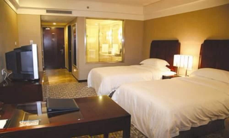 Imagen de la habitación del Hotel Grand New Century Binhai Tianjin. Foto 12