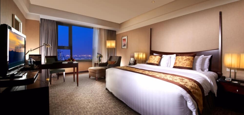 Imagen de la habitación del Hotel Grand New Century Binhai Tianjin. Foto 15