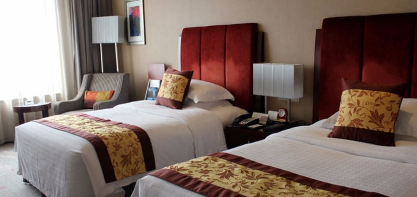 Imagen de la habitación del Hotel Grand New Century Binhai Tianjin. Foto 16