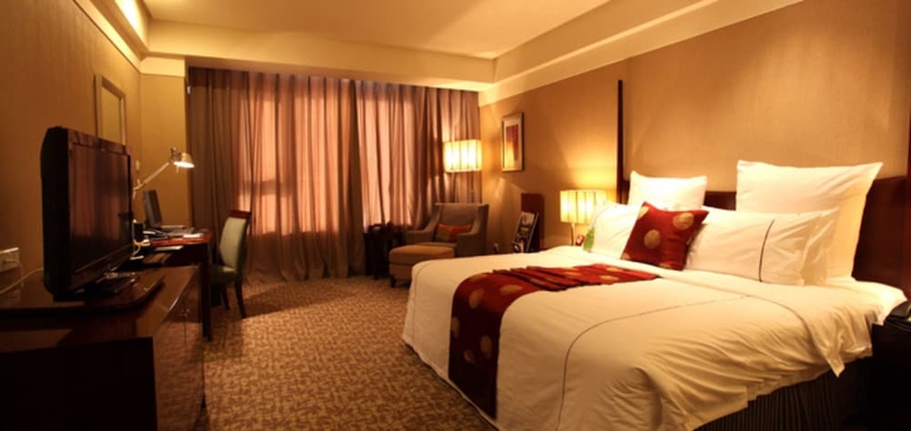 Imagen de la habitación del Hotel Grand New Century Binhai Tianjin. Foto 17