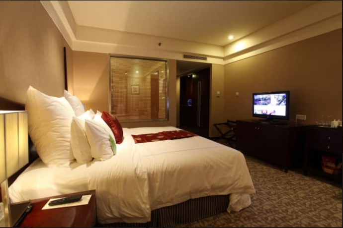 Imagen de la habitación del Hotel Grand New Century Binhai Tianjin. Foto 18