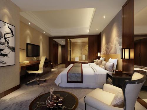 Imagen de la habitación del Hotel Grand New Century Fuyang. Foto 6