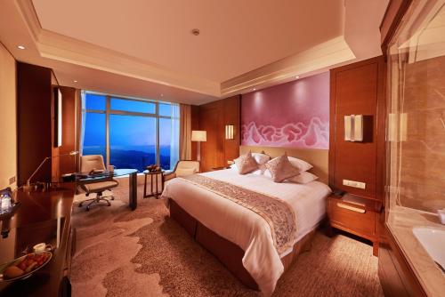 Imagen de la habitación del Hotel Grand New Century Fuyang. Foto 7