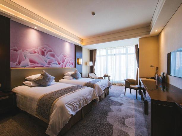 Imagen de la habitación del Hotel Grand New Century Hotel Fuyang. Foto 16