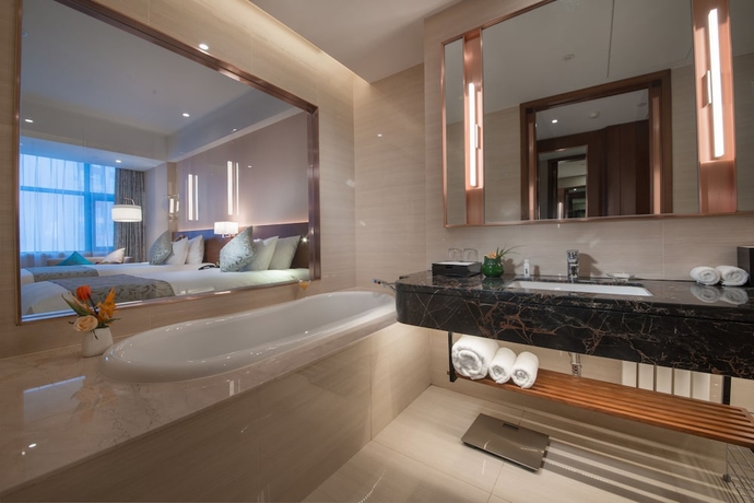 Imagen de la habitación del Hotel Grand New Century Jingyue. Foto 7