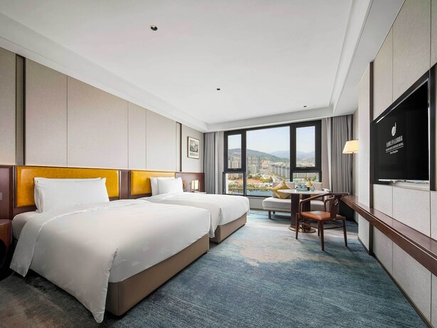 Imagen de la habitación del Hotel Grand New Century Linan Hangzhou. Foto 11