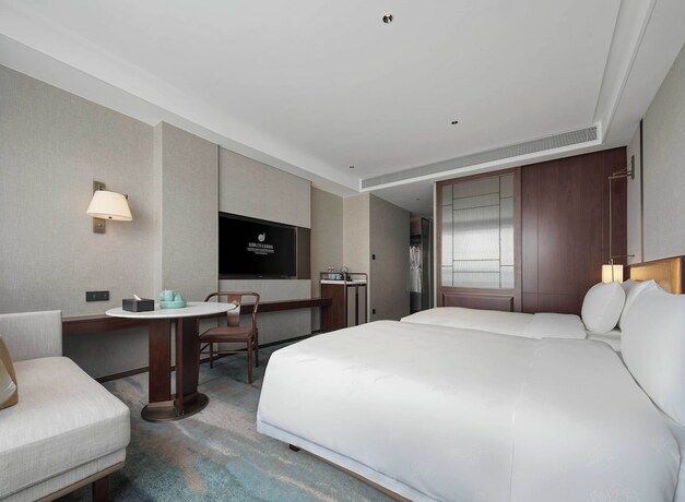 Imagen de la habitación del Hotel Grand New Century Linan Hangzhou. Foto 15