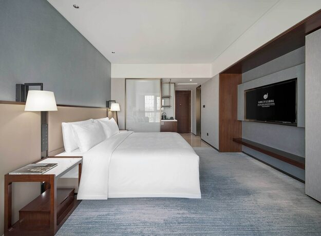 Imagen de la habitación del Hotel Grand New Century Linan Hangzhou. Foto 19