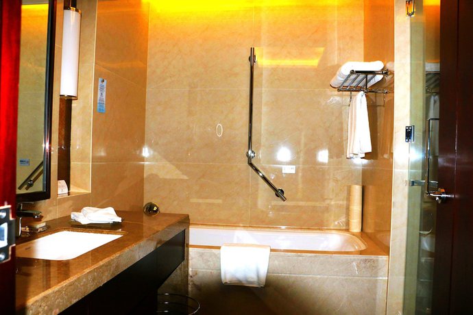 Imagen de la habitación del Hotel Grand New Century Xi'an. Foto 8
