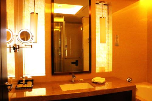 Imagen de la habitación del Hotel Grand New Century Xi'an. Foto 17