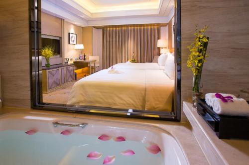 Imagen de la habitación del Hotel Grand New Century Yuhang Hangzhou. Foto 6