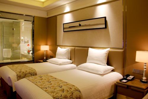 Imagen de la habitación del Hotel Grand New Century Yuhang Hangzhou. Foto 7