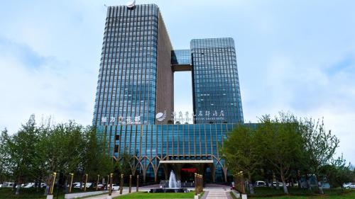 Imagen de la habitación del Hotel Grand New Century Yuhang Hangzhou. Foto 9