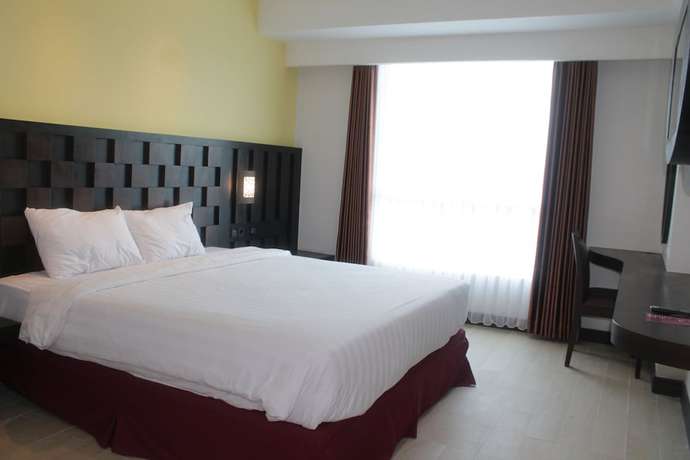 Imagen de la habitación del Hotel Grand Orchid Yogyakarta. Foto 4
