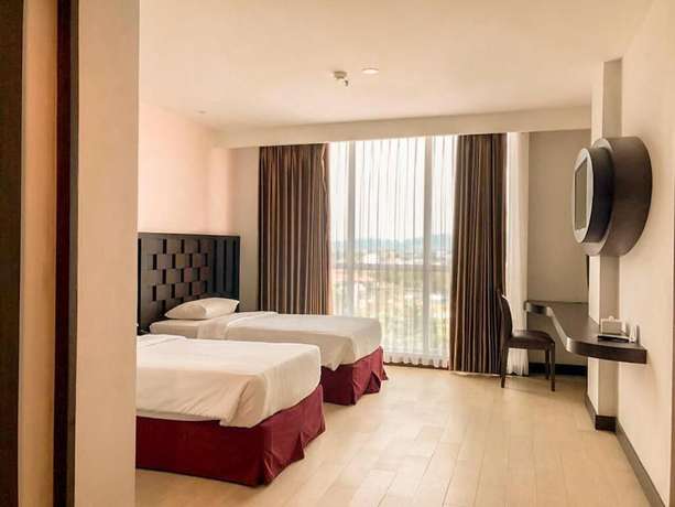 Imagen de la habitación del Hotel Grand Orchid Yogyakarta. Foto 8