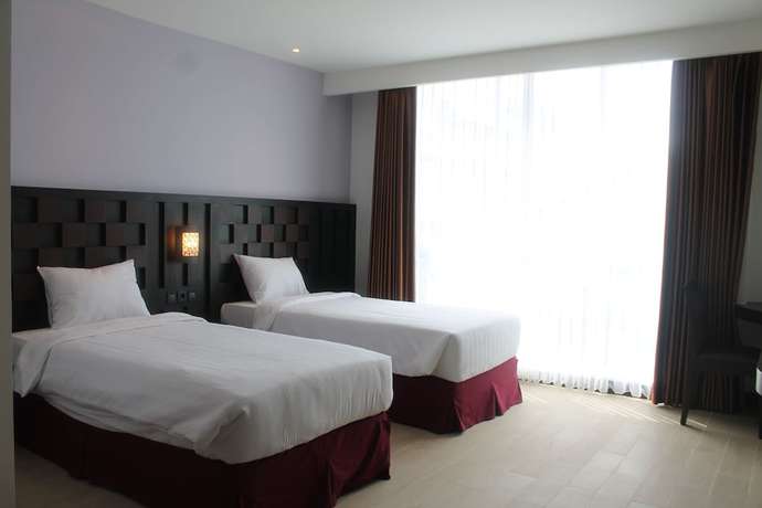 Imagen de la habitación del Hotel Grand Orchid Yogyakarta. Foto 12
