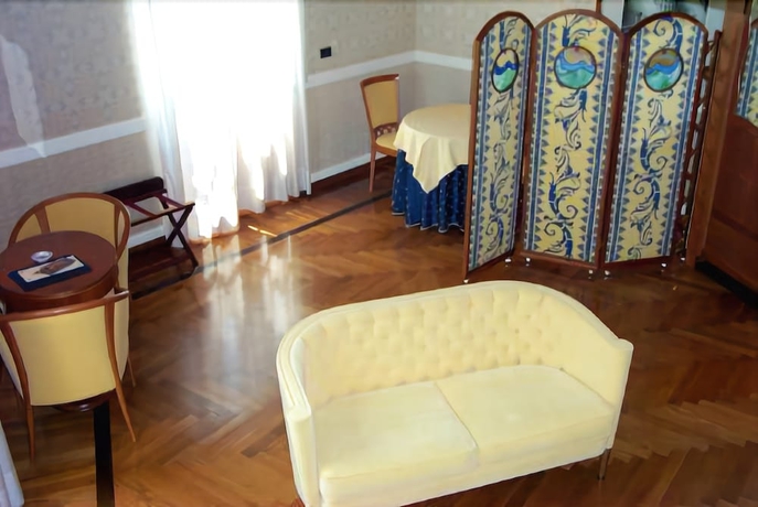 Imagen de la habitación del Hotel Grand Ortigia Siracusa. Foto 13