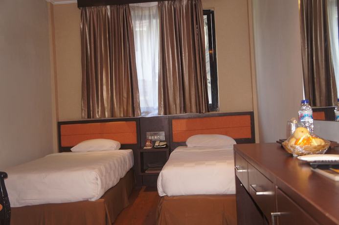 Imagen de la habitación del Hotel Grand Palace Makassar. Foto 9