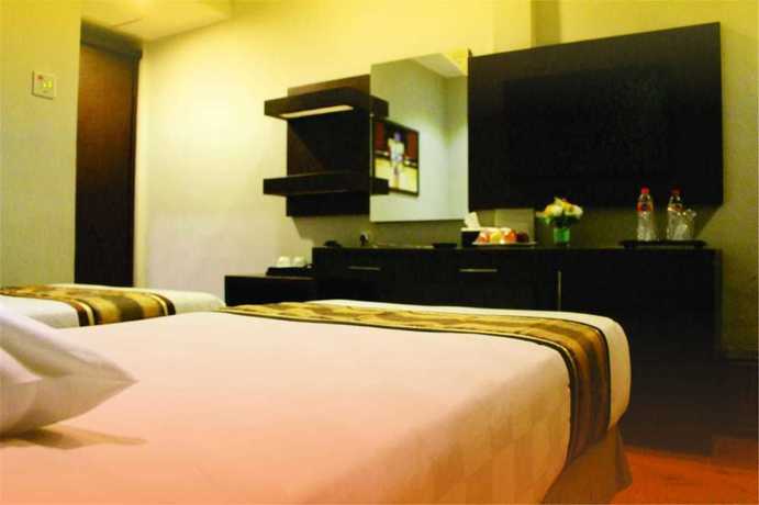 Imagen de la habitación del Hotel Grand Palace Makassar. Foto 11