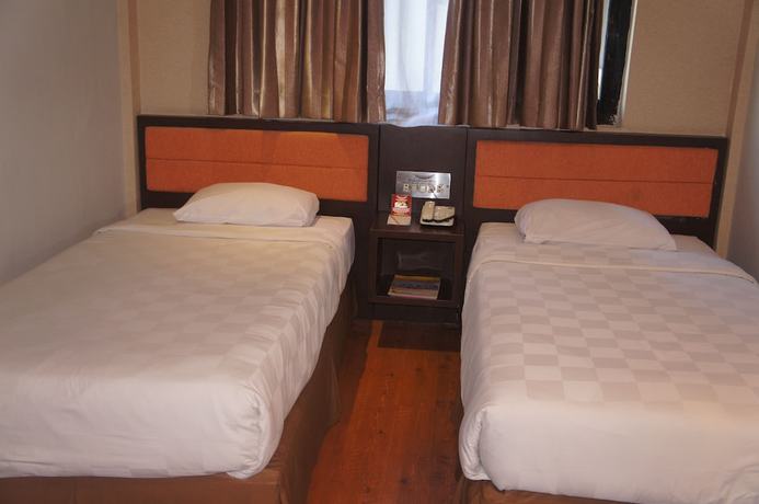 Imagen de la habitación del Hotel Grand Palace Makassar. Foto 12