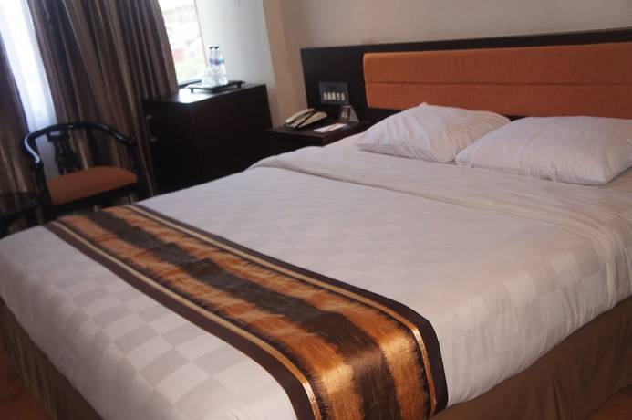 Imagen de la habitación del Hotel Grand Palace Makassar. Foto 13
