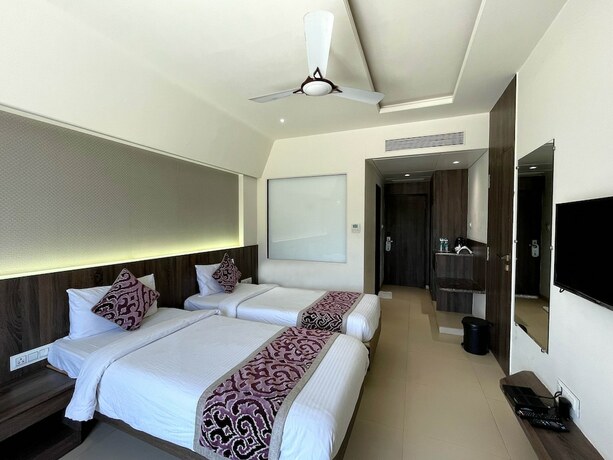 Imagen de la habitación del Hotel Grand Parivaar. Foto 16