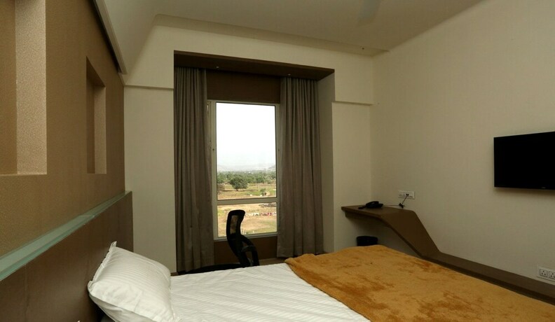 Imagen de la habitación del Hotel Grand Parivaar. Foto 25