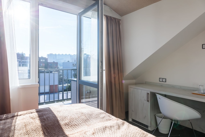Imagen de la habitación del Hotel Grand Petit. Foto 15