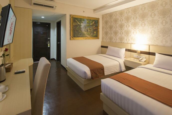 Imagen de la habitación del Hotel Grand Puri Saron Yogyakarta. Foto 18