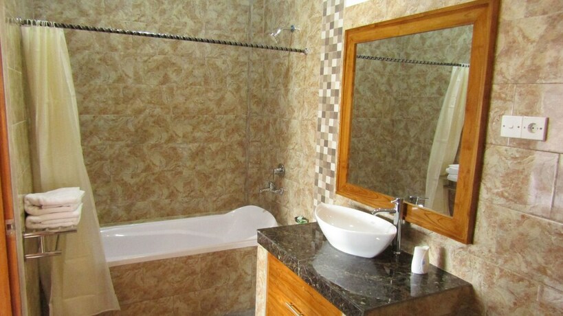 Imagen de la habitación del Hotel Grand Raka Homestay. Foto 31