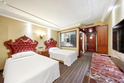 Imagen de la habitación del Hotel Grand Regency, Qingdao. Foto 7