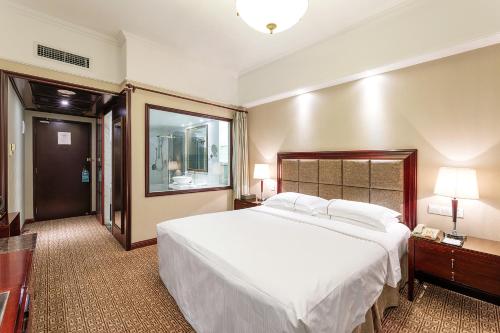 Imagen de la habitación del Hotel Grand Regency, Qingdao. Foto 10