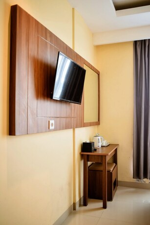 Imagen de la habitación del Hotel Grand Renggali. Foto 20
