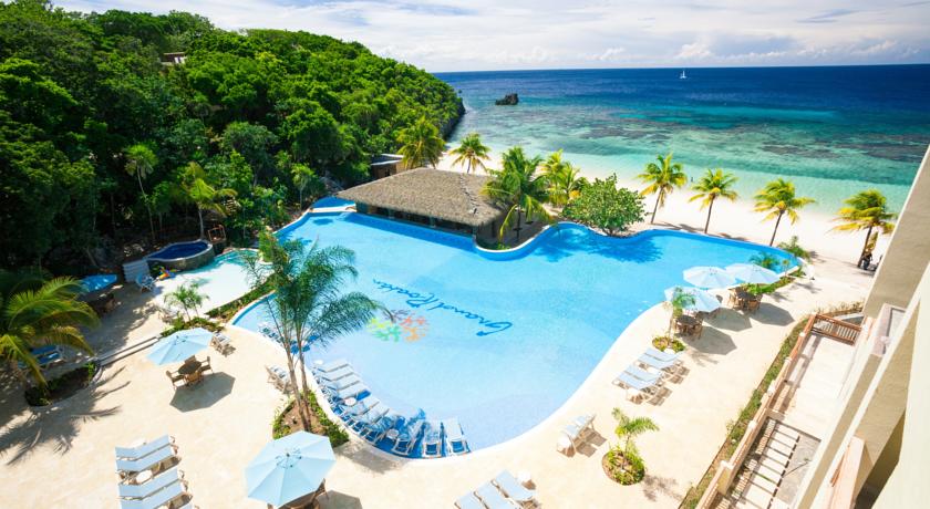 Imagen de la piscina del Hotel Grand Roatan Caribbean Resort. Foto 12