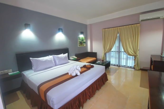 Imagen de la habitación del Hotel Grand Santhi. Foto 5