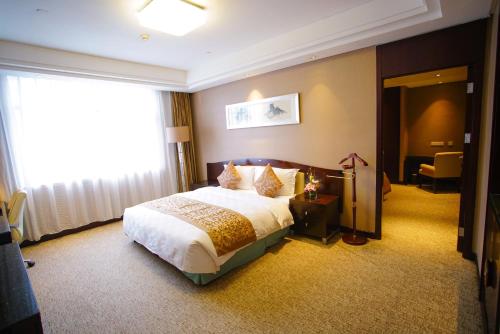 Imagen de la habitación del Hotel Grand Soluxe International Xi'an. Foto 12