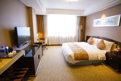 Imagen de la habitación del Hotel Grand Soluxe International Xi'an. Foto 14