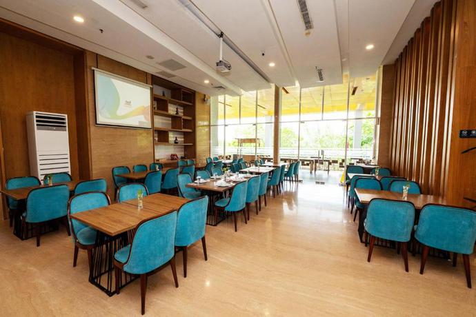 Imagen del bar/restaurante del Hotel Grand Tan Banjarmasin & Convention Center. Foto 3