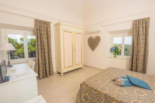 Imagen de la habitación del Hotel Grand Villa Parisi. Foto 6