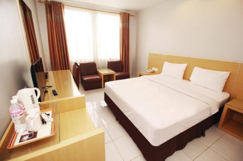 Imagen de la habitación del Hotel Grande Lampung Powered by Archipelago. Foto 17
