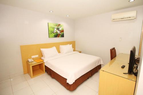 Imagen de la habitación del Hotel Grande Lampung Powered by Archipelago. Foto 19