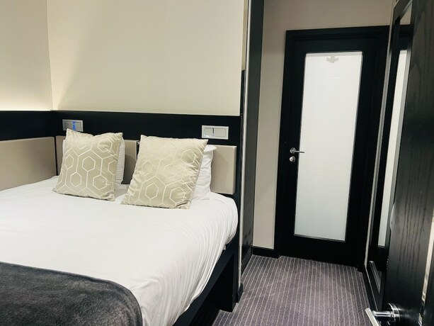 Imagen de la habitación del Hotel Great St Helen. Foto 17