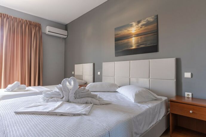 Imagen de la habitación del Hotel GrecoInn Atrium. Foto 17