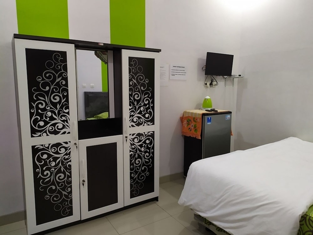 Imagen de la habitación del Hotel Green Belt Kost Exclusive. Foto 15