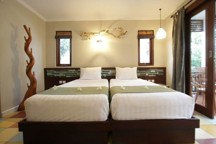Imagen de la habitación del Hotel Green Bird Villa. Foto 13