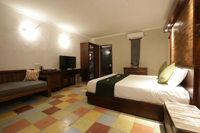 Imagen de la habitación del Hotel Green Bird Villa. Foto 19