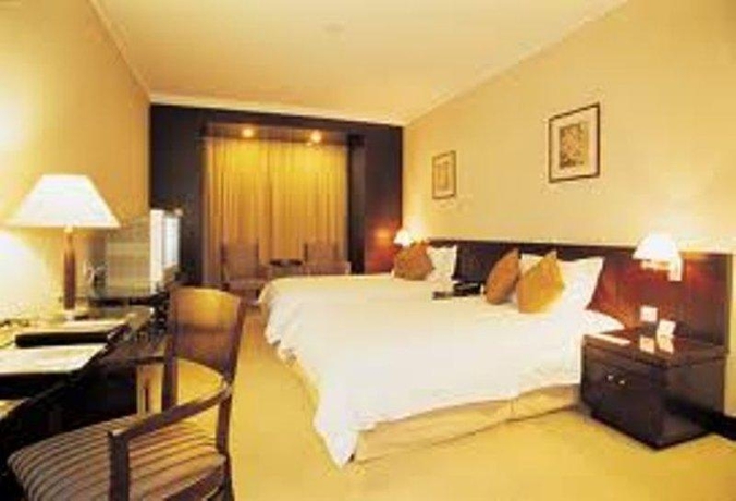 Imagen de la habitación del Hotel Green Garden, Shanghai. Foto 3