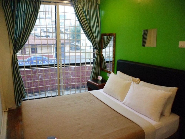 Imagen de la habitación del Hotel Green Hut Lodge. Foto 10